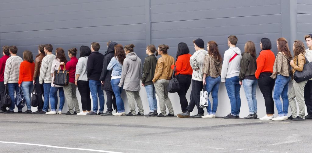 Group Of Individuals In A Queue